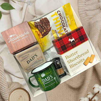 New Dad Relax & Unwind Gift Box with biscuits and dad mug on fabric background