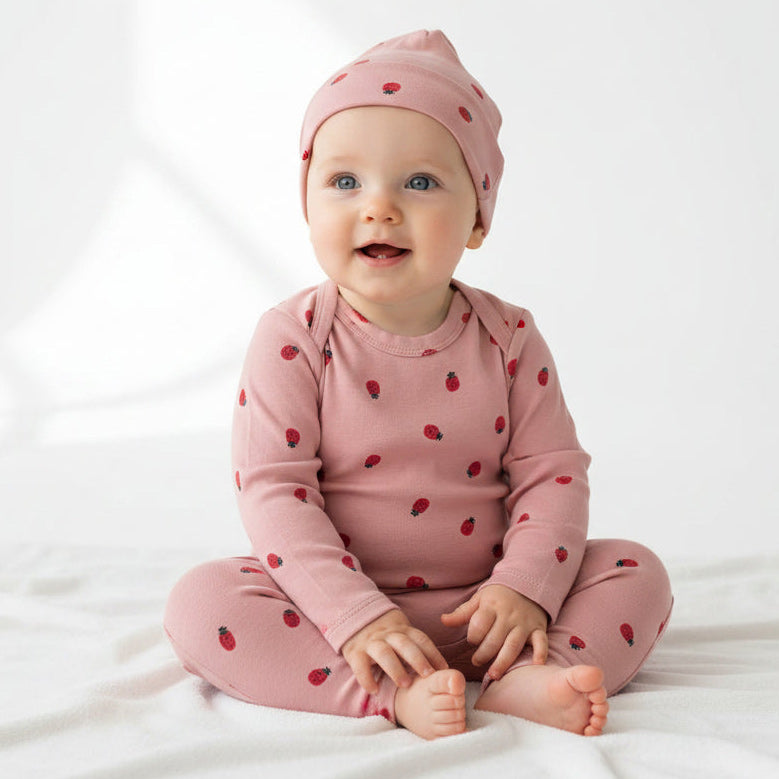 Bonds baby pink baby clothing set with ladybugs print on a baby