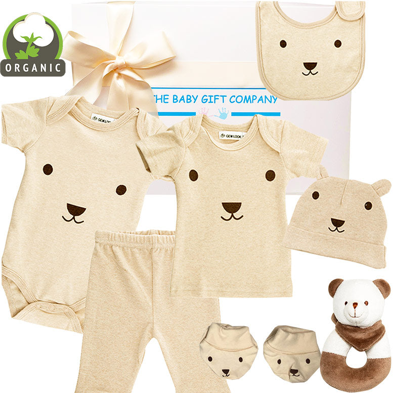 Baby clothing set with bear face designs from The Baby Gift Company on a white background.