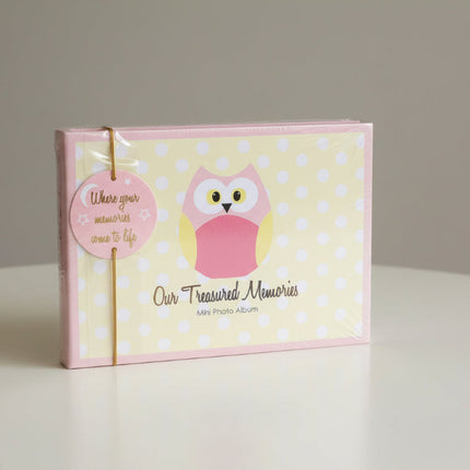 Mini photo album with pink owl design and 'Our Treasured Memories' text on a polka dot background.