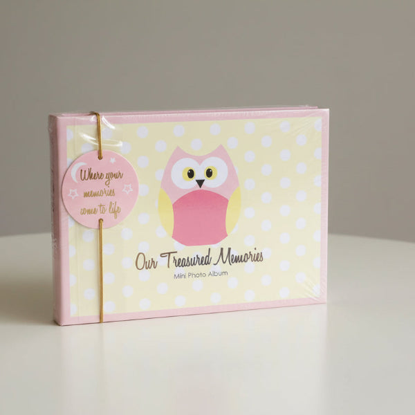 Mini photo album with pink owl design and 'Our Treasured Memories' text on a polka dot background.