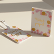 pink spot baby first passport and tag set on table