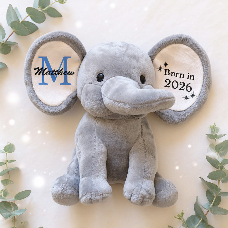 Large personalised grey elephant on light background with greenery