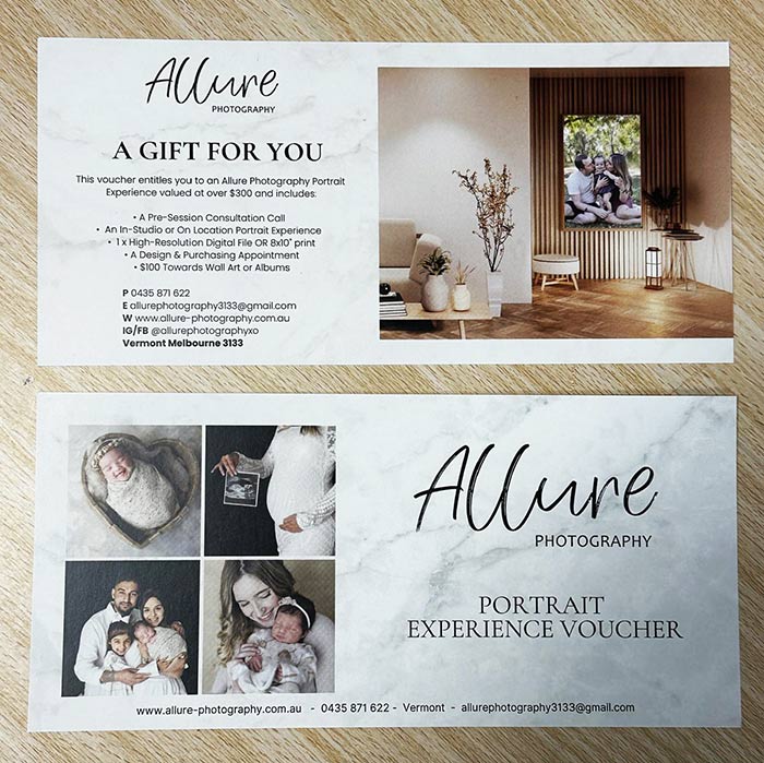 Allure Photography gift voucher on a wooden surface