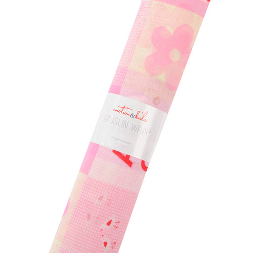 Pink floral sun wrap with a brand label on a white background