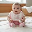 Baby girl wearing a cute pink outfit