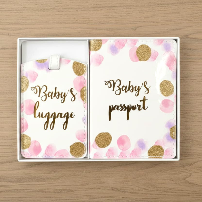 pink baby passport set on table