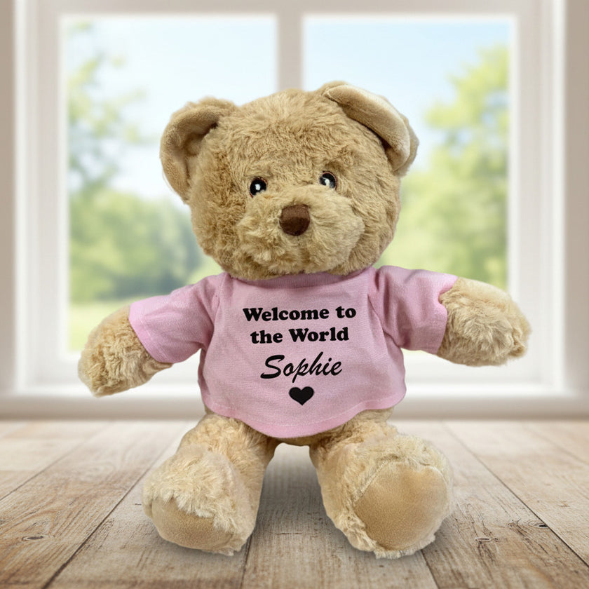 Teddy bear with pink top personalised with welcome to the world Sophie.
