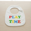 White bib with colorful 'PLAY TIME' text on a table background