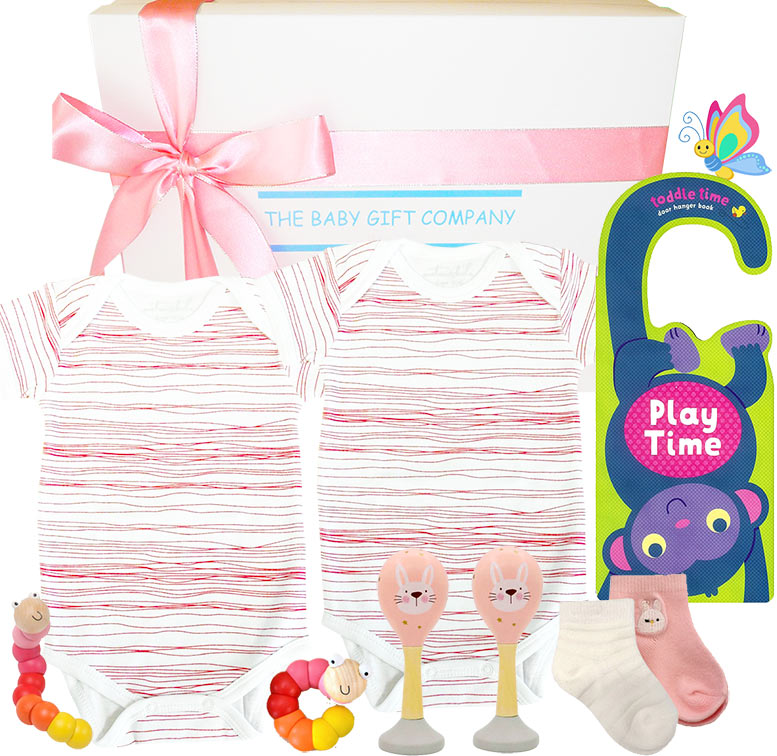 gift set with baby clothes and toys