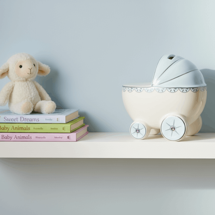 pram money box on nursery shelf
