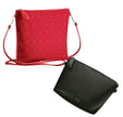 Red geometric-patterned crossbody bag and black pouch on a white background