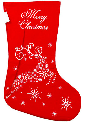 Red Christmas stocking with white reindeer and snowflake design on a white background