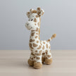 Plush giraffe toy on a table