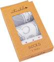 Box of socks with 'emotion & kids' branding on a white background
