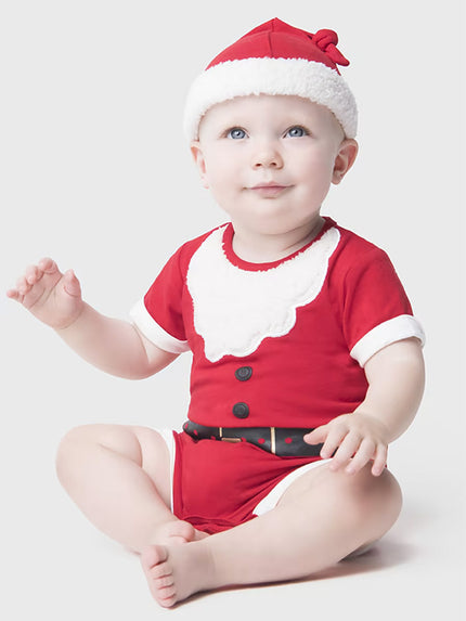 Baby wearing a red Santa outfit with a white background
