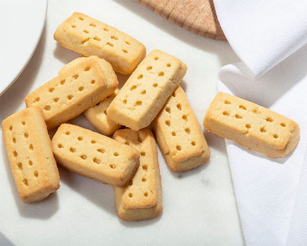 Shortbread cookies on a marble surface with a white napkin