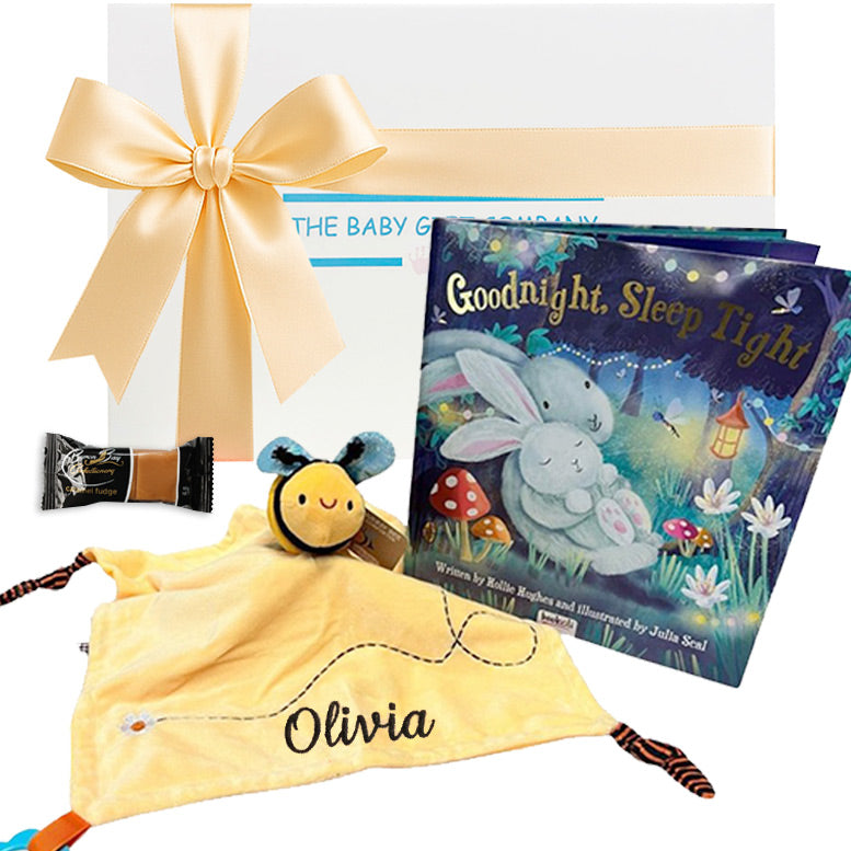 Baby gift set with yellow bee comforter with Olivia personalisation , bed time book and white gift box from The Baby Gift Company.