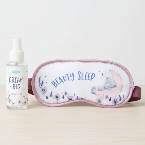 Sleep mask with 'Beauty Sleep' text and pillow mist bottle on a white background