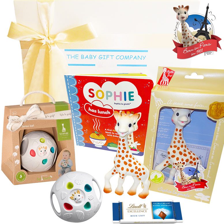 Collection of baby products including a giraffe toy, book, and rattle with visible branding.