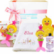 Baby gift set with mermaid-themed toys and a towel, branded by The Baby Gift Company.