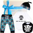 Baby gift set with blue stormtropper pants, white onesie, and black jedi bib featuring Star Wars-themed designs.