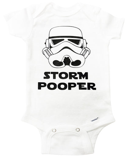 White baby onesie with a stormtrooper helmet graphic and 'STORM POOPER' text on a white background