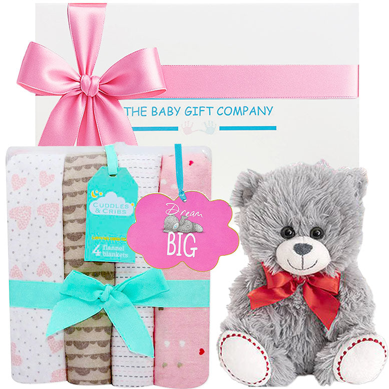 Baby gift set with teddy bear, blankets, and 'The Baby Gift Company' packaging.