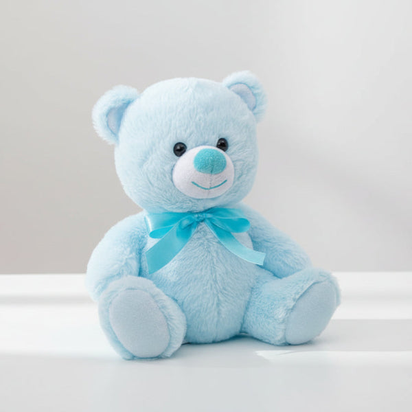 Blue teddy bear with a bow on a white background