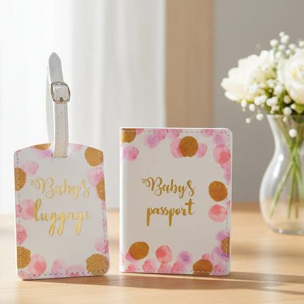 Set of 'Baby's Luggage' and 'Baby's Passport' with dots design and 'Baby's' text. Shown table with flowers