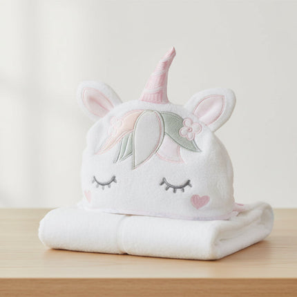 Unicorn-shaped towel for baby with a white background