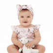 Baby girl wearing pink romper and headband with bunny