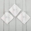 White baby face cloths on table