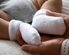 white baby socks on baby feet