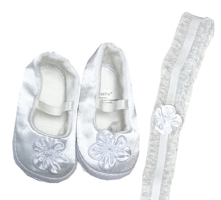 White slip-on shoes with floral designs and matching socks on a white background