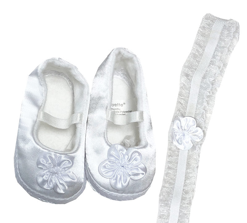 White slip-on shoes with floral designs and matching socks on a white background