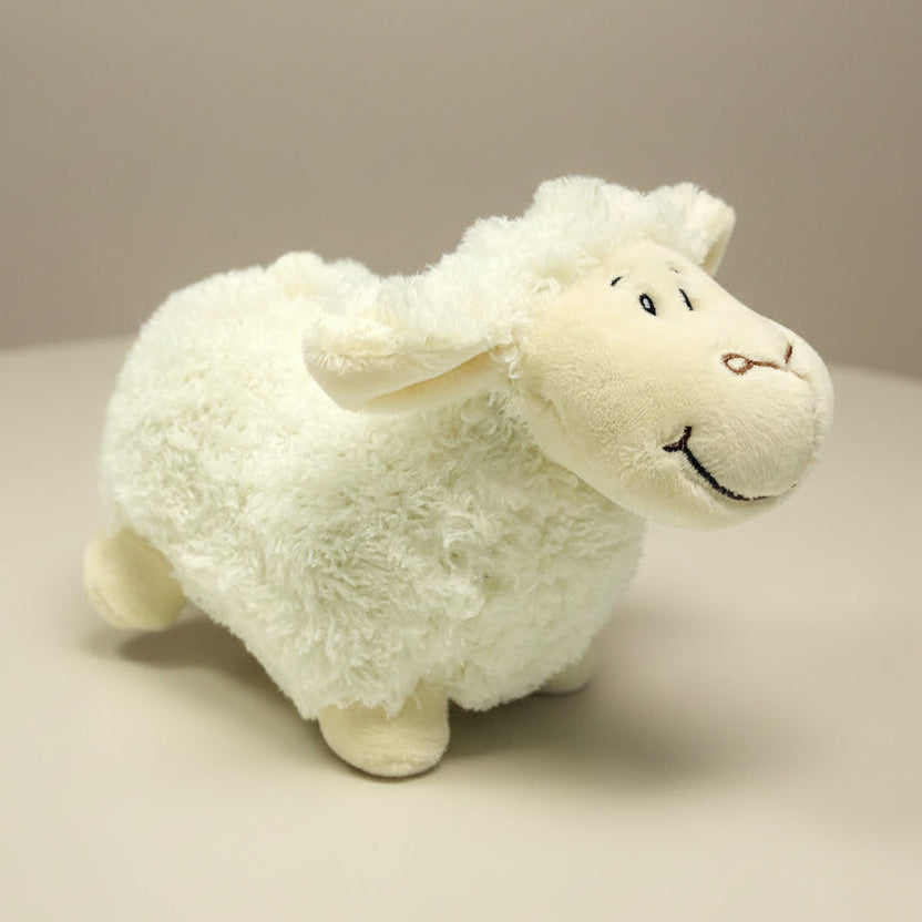 white lamb toy on table