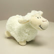 white lamb toy on table