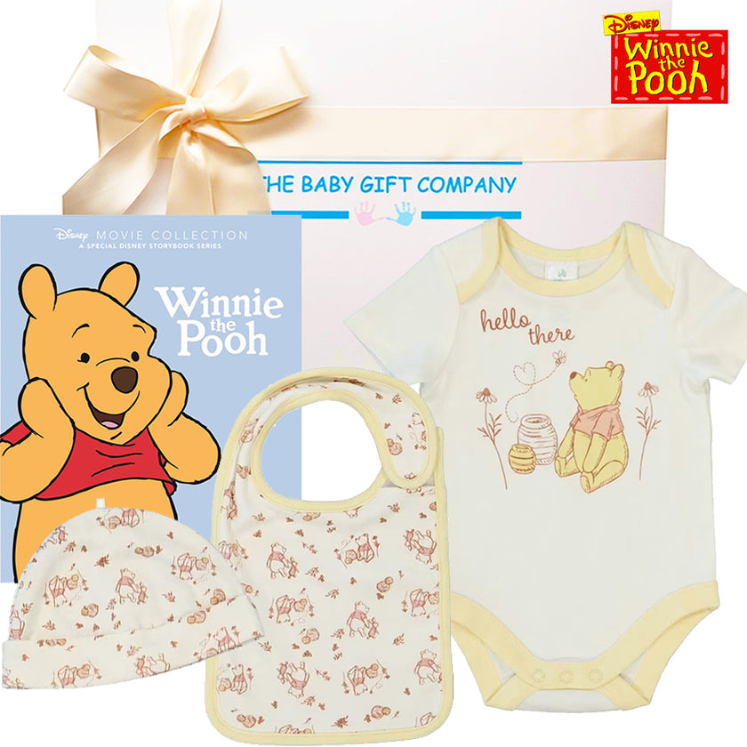 Winnie the Pooh-themed baby gift set with bib, hat, onesie, and Disney story book.