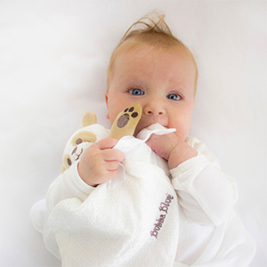 Introduce a comforter or soft toy for a newborn to sleep